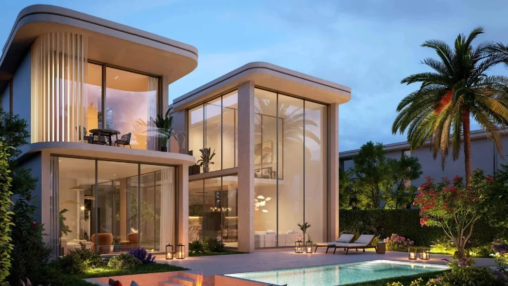 Villa exterior showing living and dining interiors with garden landscaping at Manchester City Yas Residences by Ohana